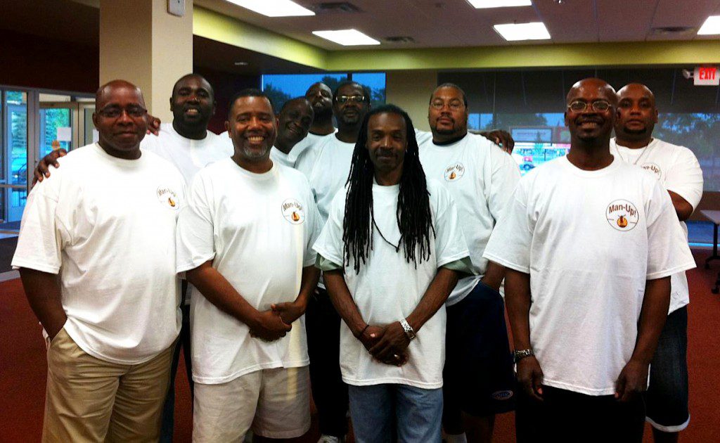 Nehemiah Center for Urban Leadership Development's Man-Up group is for men who have been incarcerated and are trying to stay on the straight and narrow. Cooper (second from left), Dillard (fourth from left) and Hicks (back) are pictured here.