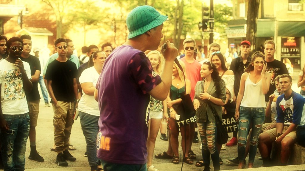 Fans gather at the top of State St. to be entertained by Ted Park at UCAN's summer concert series. (Photo by Memory)
