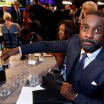 Idris Elba sits with his two awards at the 22nd Screen Actors Guild Awards in Los Angeles