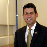 U.S. Representative Paul Ryan (R-WI) smiles as he walks at the end of the day of the House Freedom Caucus meeting on Capitol Hill in Washington