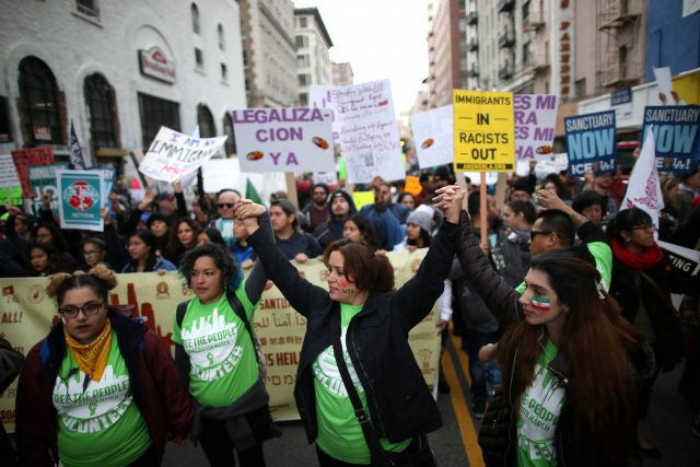 People participate in a protest march calling for human rights and dignity for immigrants, in Los Angeles