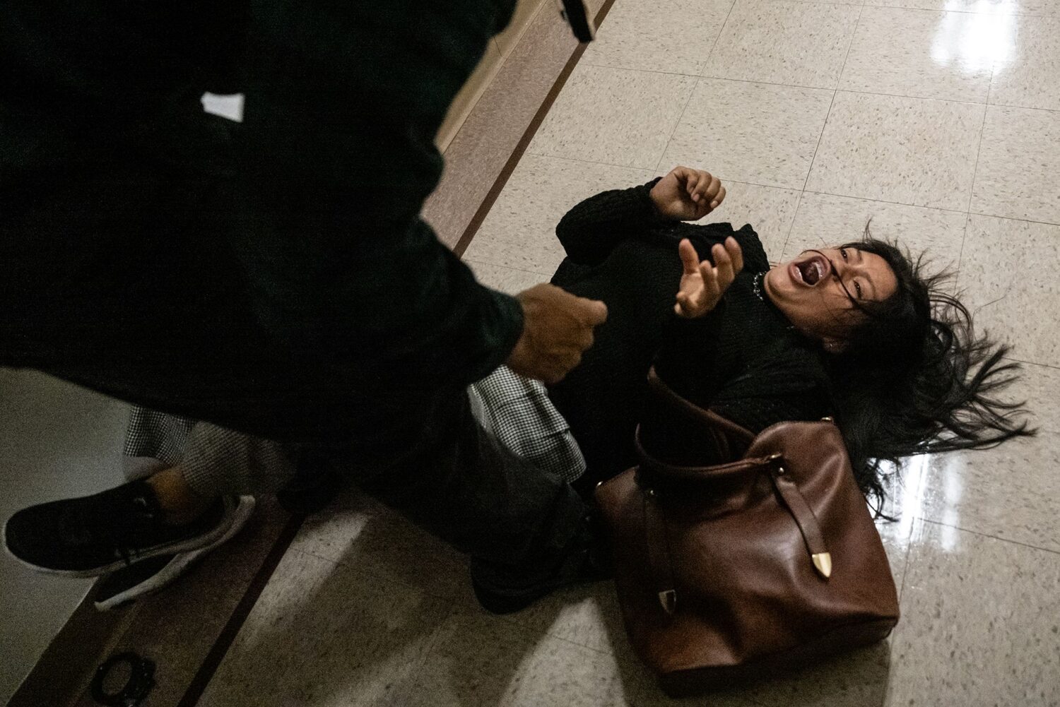 Federal agent pushes woman to floor in immigration courthouse confrontation that sparks outrage