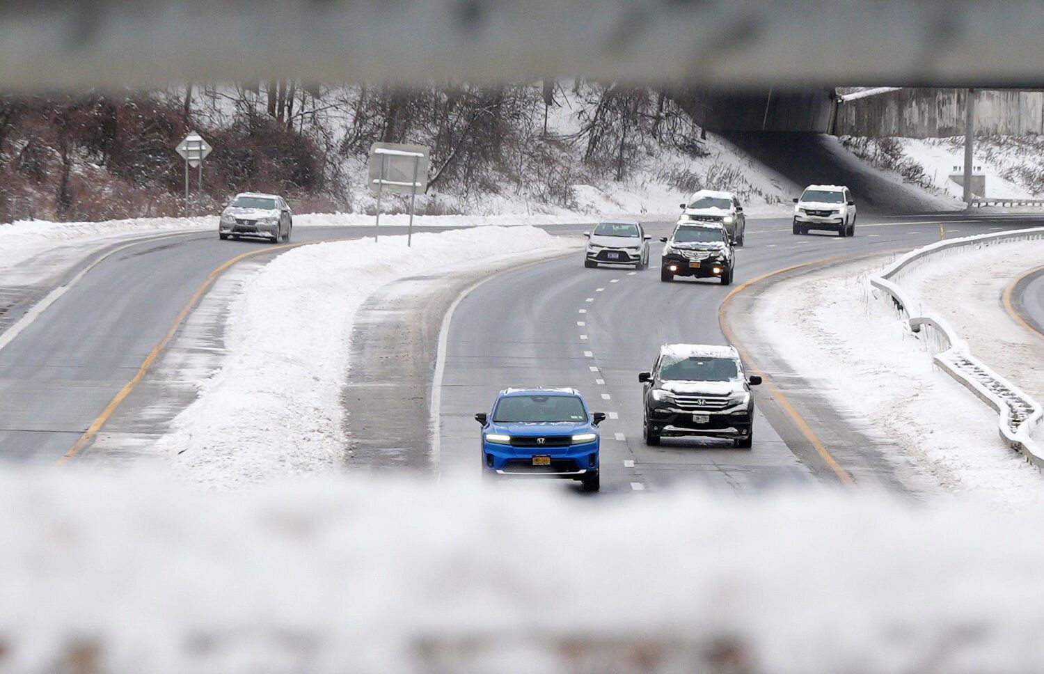 Blizzard conditions snarl holiday travel as tornadoes leave damage in the Midwest